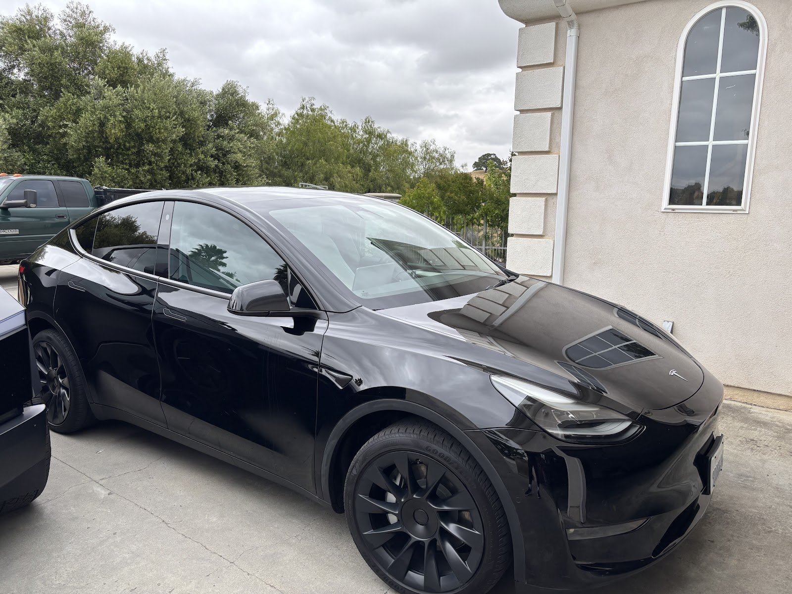 Black Tesla Model Y with window tint by Roman's